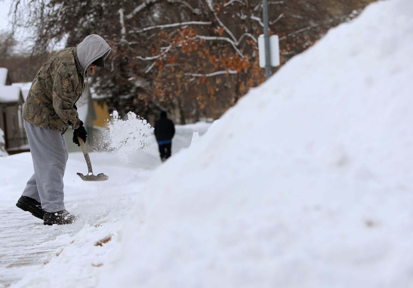 Jeff Cooley clears his sidewalk